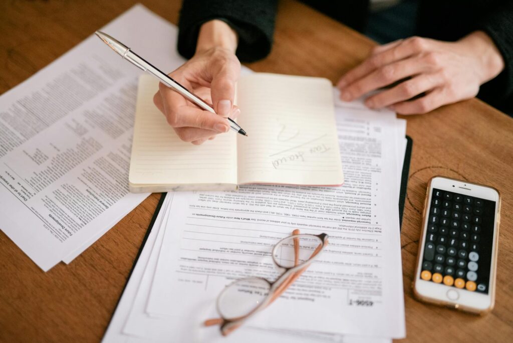 A year-end retirement statement and notepad on an organized desk