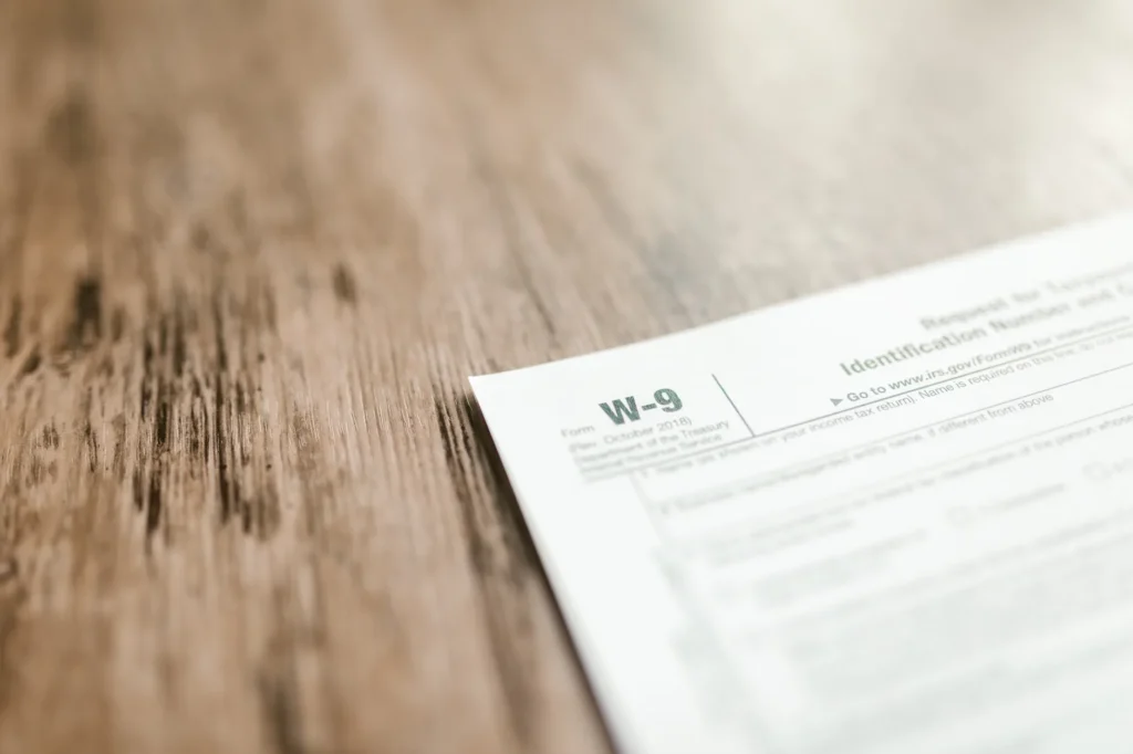 A folder of tax documents arranged neatly on a desk.