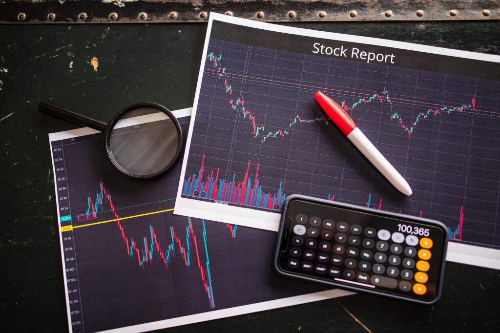 Printed portfolio allocation sheet with a calculator on an organized desk