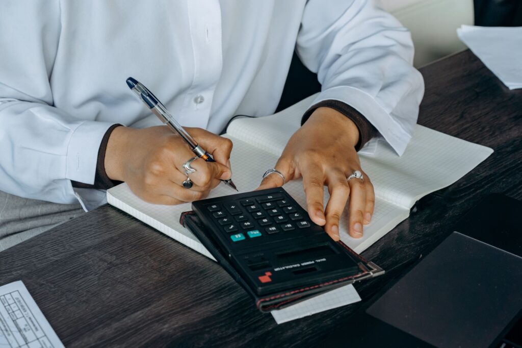 Household budgeting and retirement planning materials spread across a table